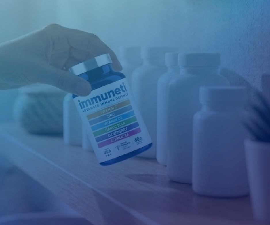 Hand holding Immuneti supplement bottle in front of multiple unlabeled bottles in the background, representing product comparison and differentiation